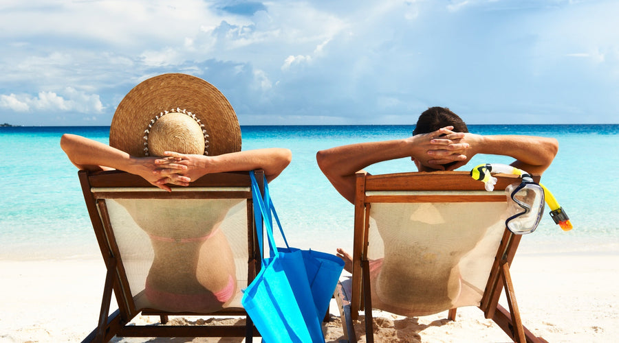Couple on beach getting sun exposure