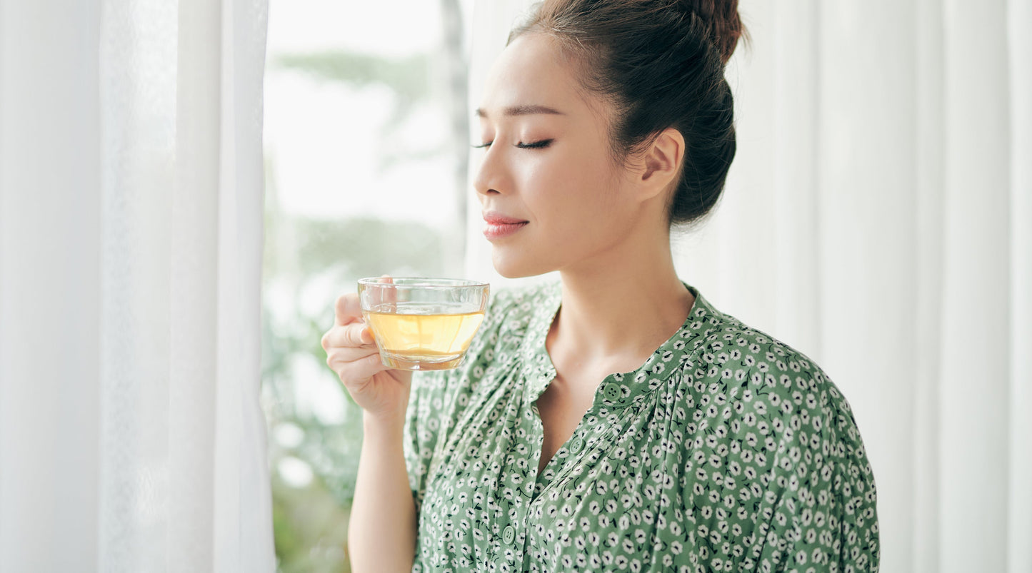 Woman Drinking Green Tea For Health Benefits