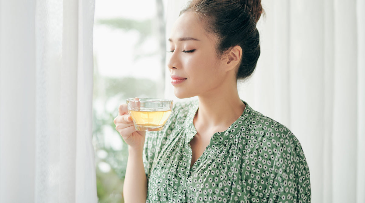 Woman Drinking Green Tea For Health Benefits