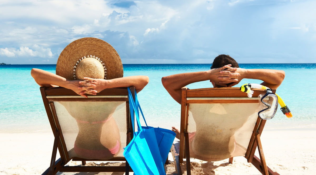 Couple on beach getting sun exposure
