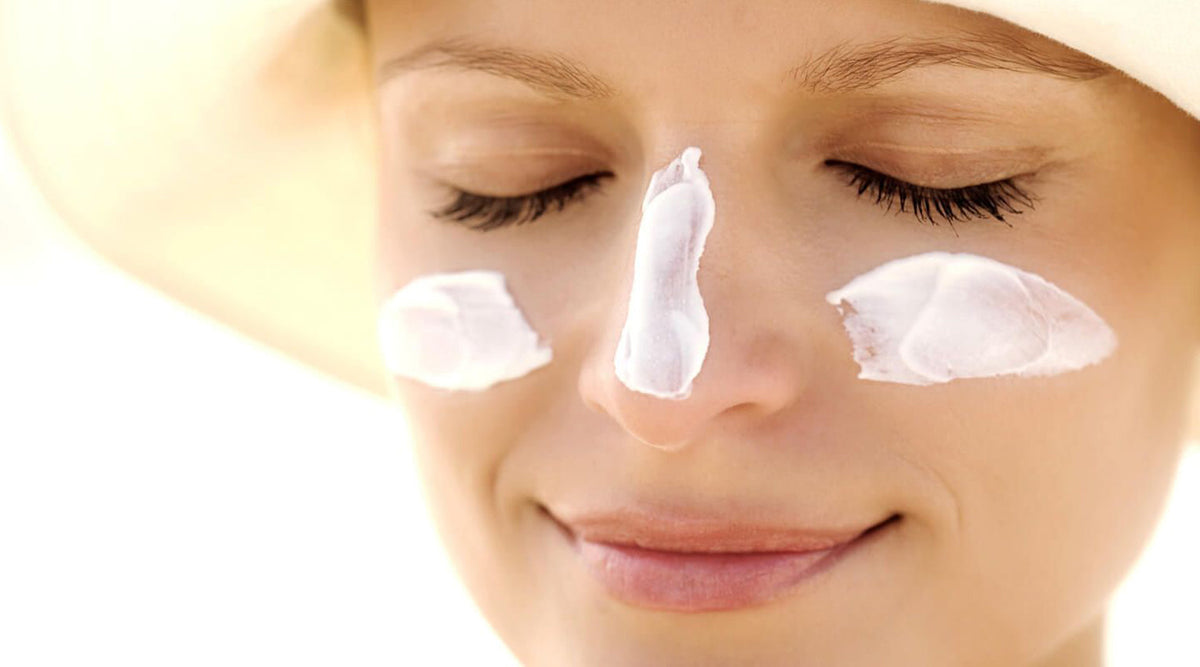 Woman With Sunscreen On Her Face For Sun Protection