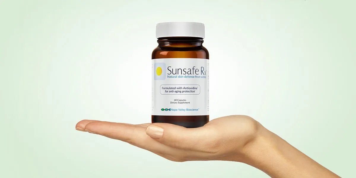 Sunsafe Rx bottle held in an open hand